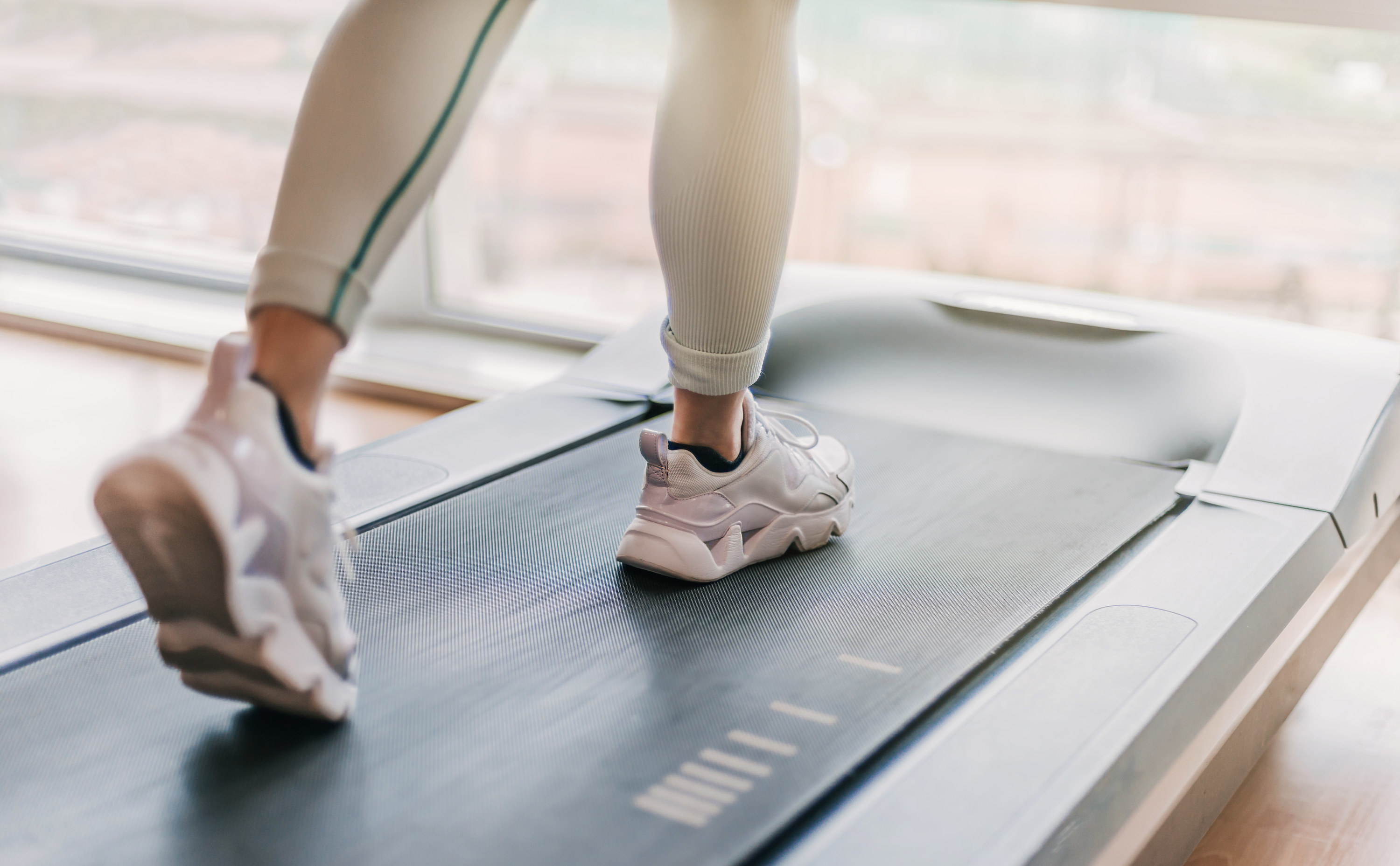 feet walking on a treadmill