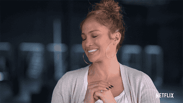 jennifer lopez smiling and giving a thumbs down