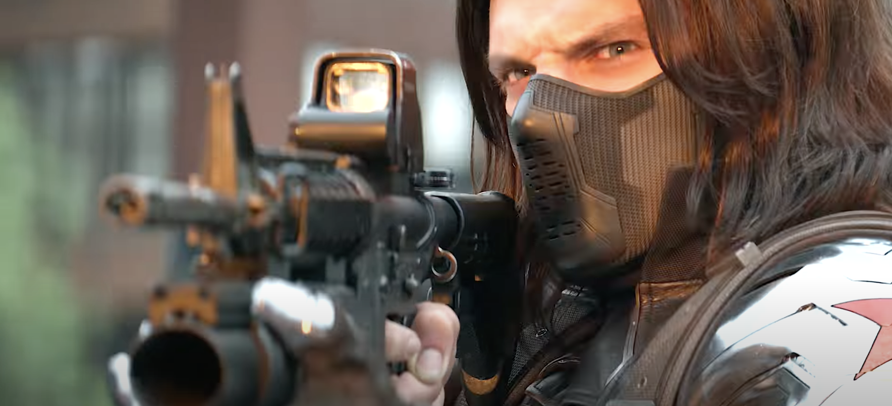 The Winter Soldier holds a gun