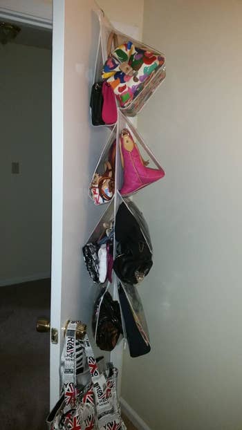 Side view of the purse organizer hanging over a door