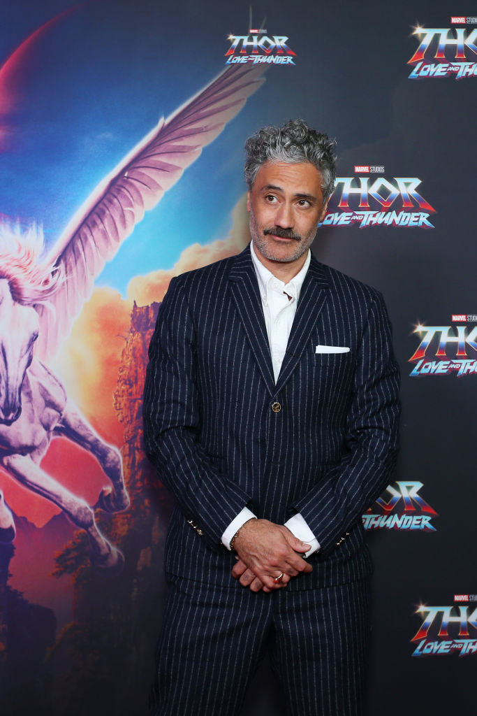In a suit on the red carpet for Thor: Love and Thunder