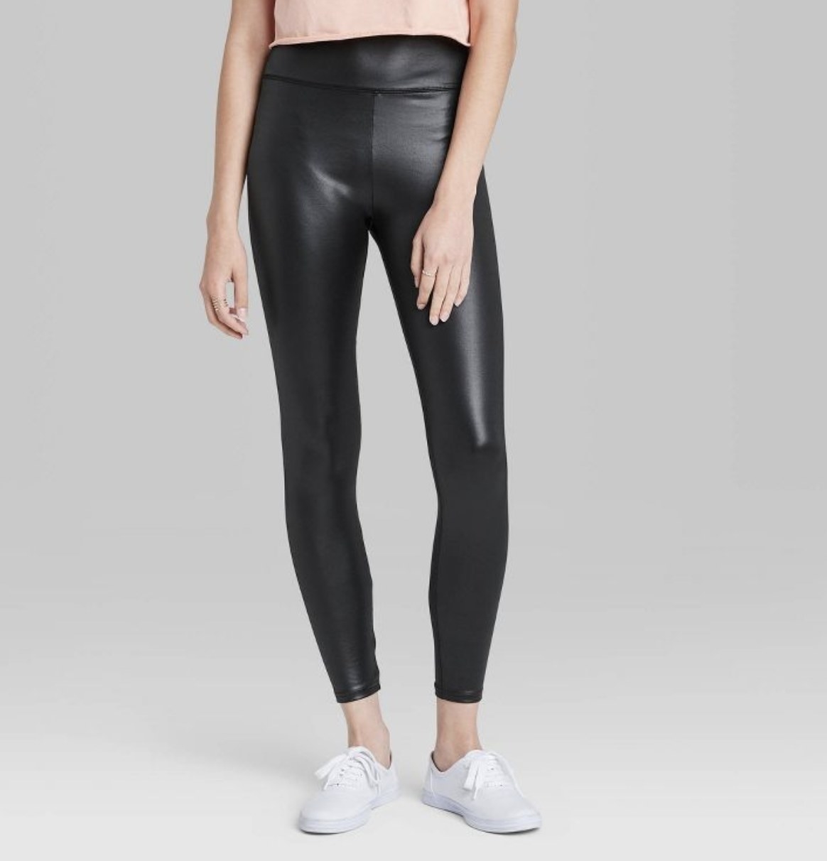 Model wearing faux leather leggings