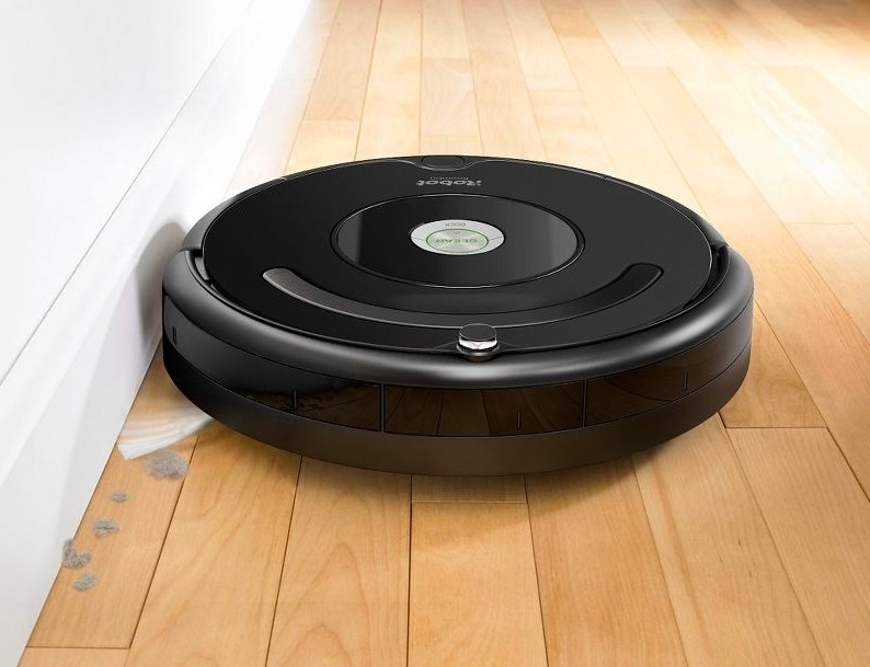 Roomba cleaning a hardwood floor