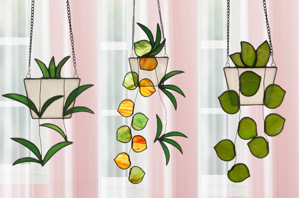 Three of the stained glass plants are shown hanging