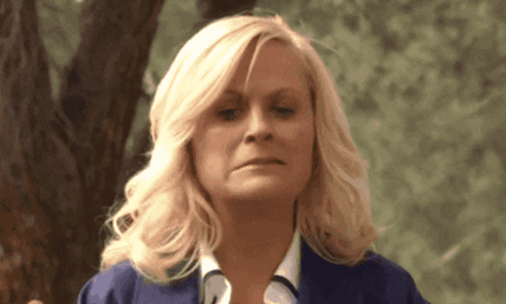 leslie knope trying to spit something out of her mouth in parks and rec