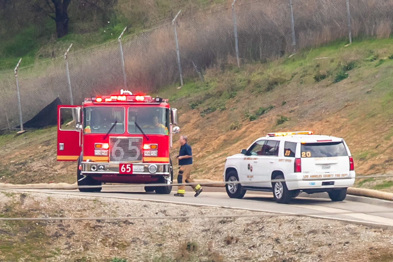 A firetruck and a police vehicle at the site of a helicopter crash on January 26, 2020, in Calabasas, California