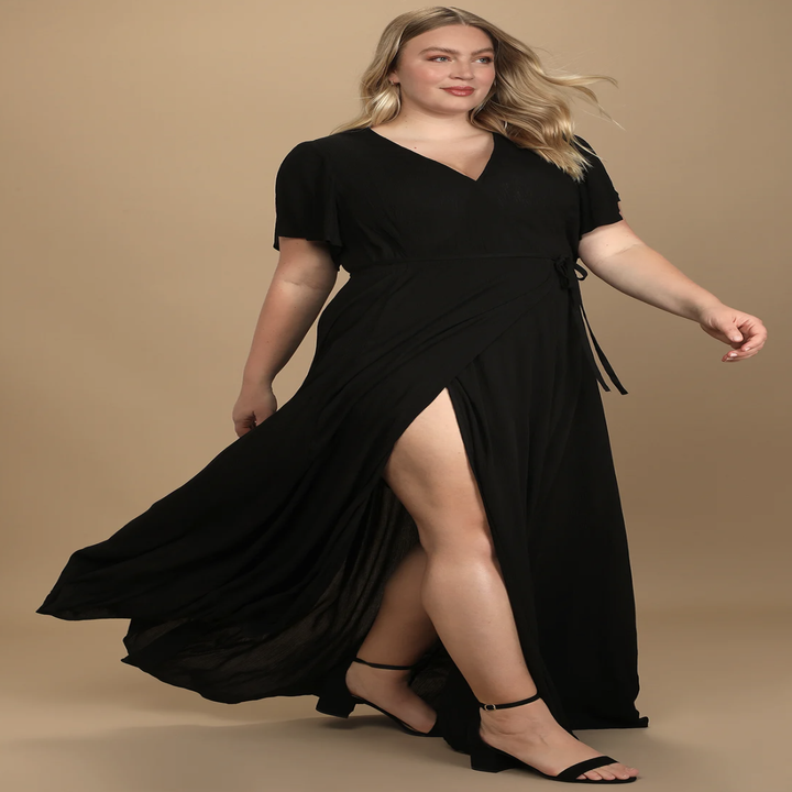 model wearing black wrap dress