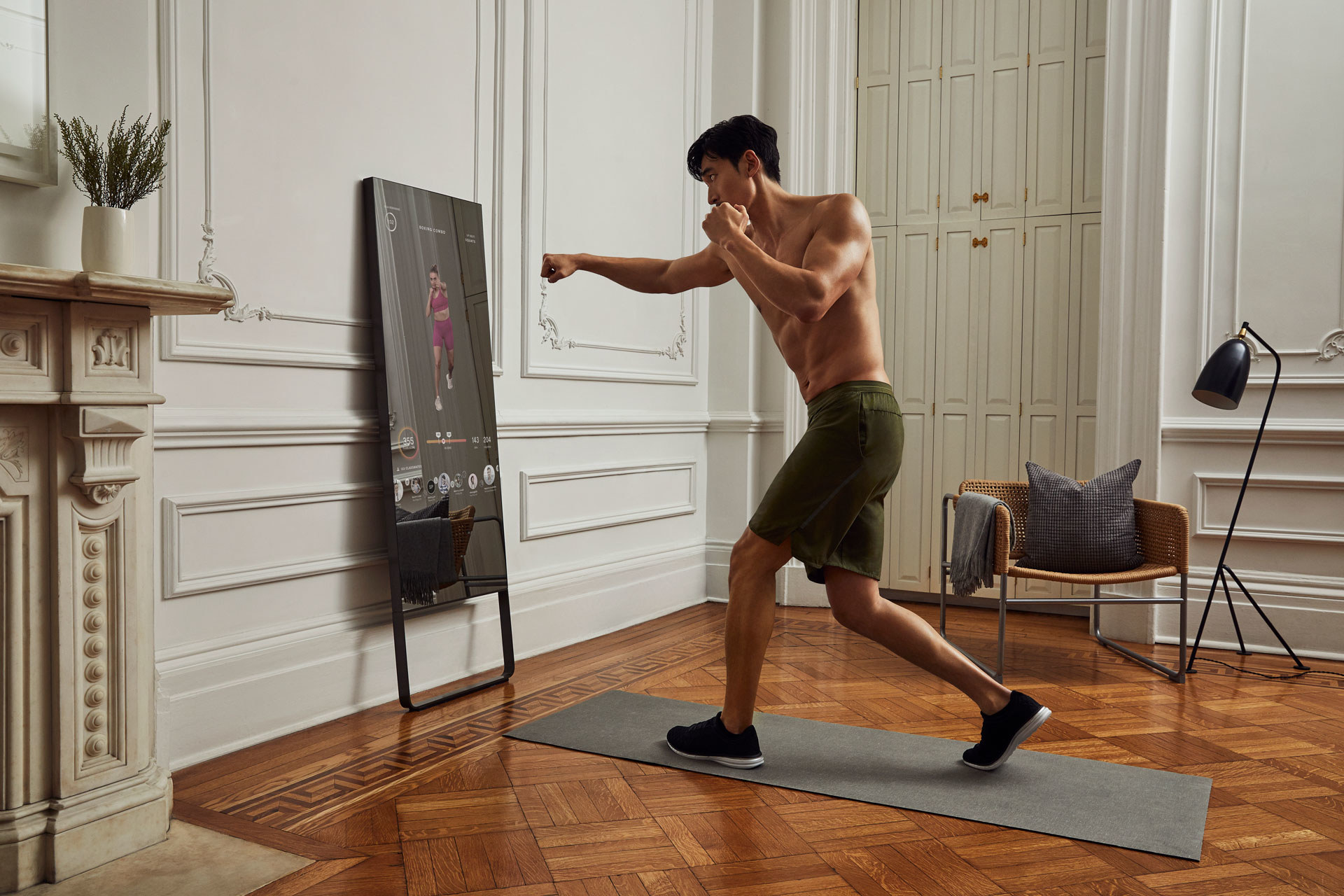 a model does yoga in front of the mirror