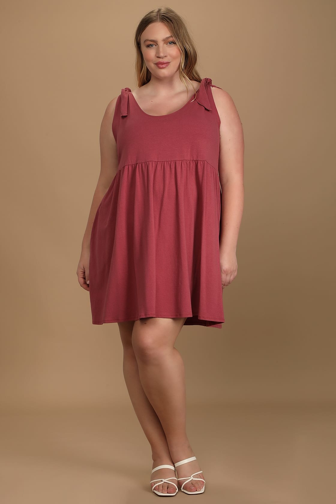 Model wearing burgundy babydoll dress