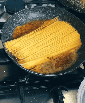 GIF of pasta in rocking pan