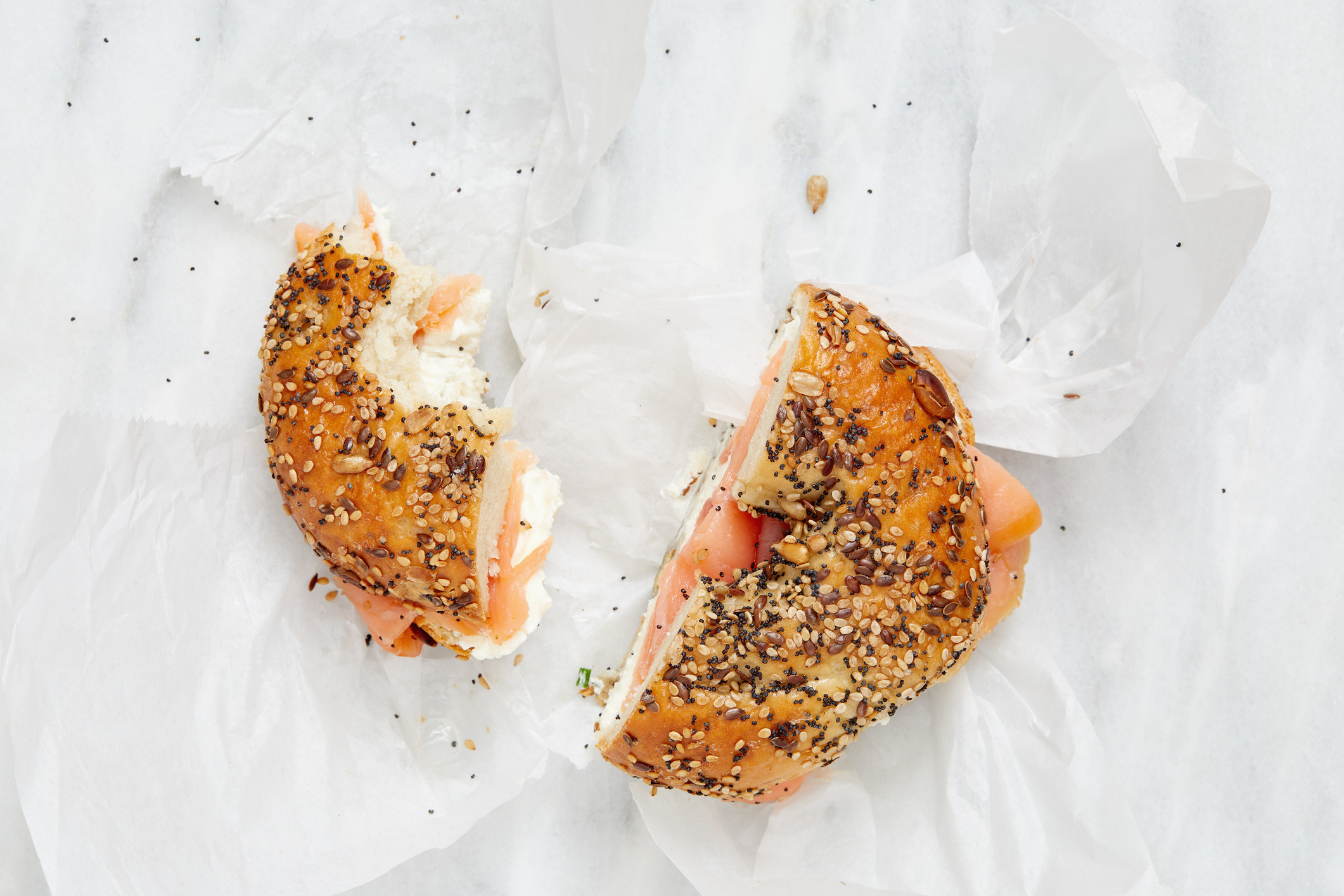 Overhead view of bagel with lox and cream cheese.
