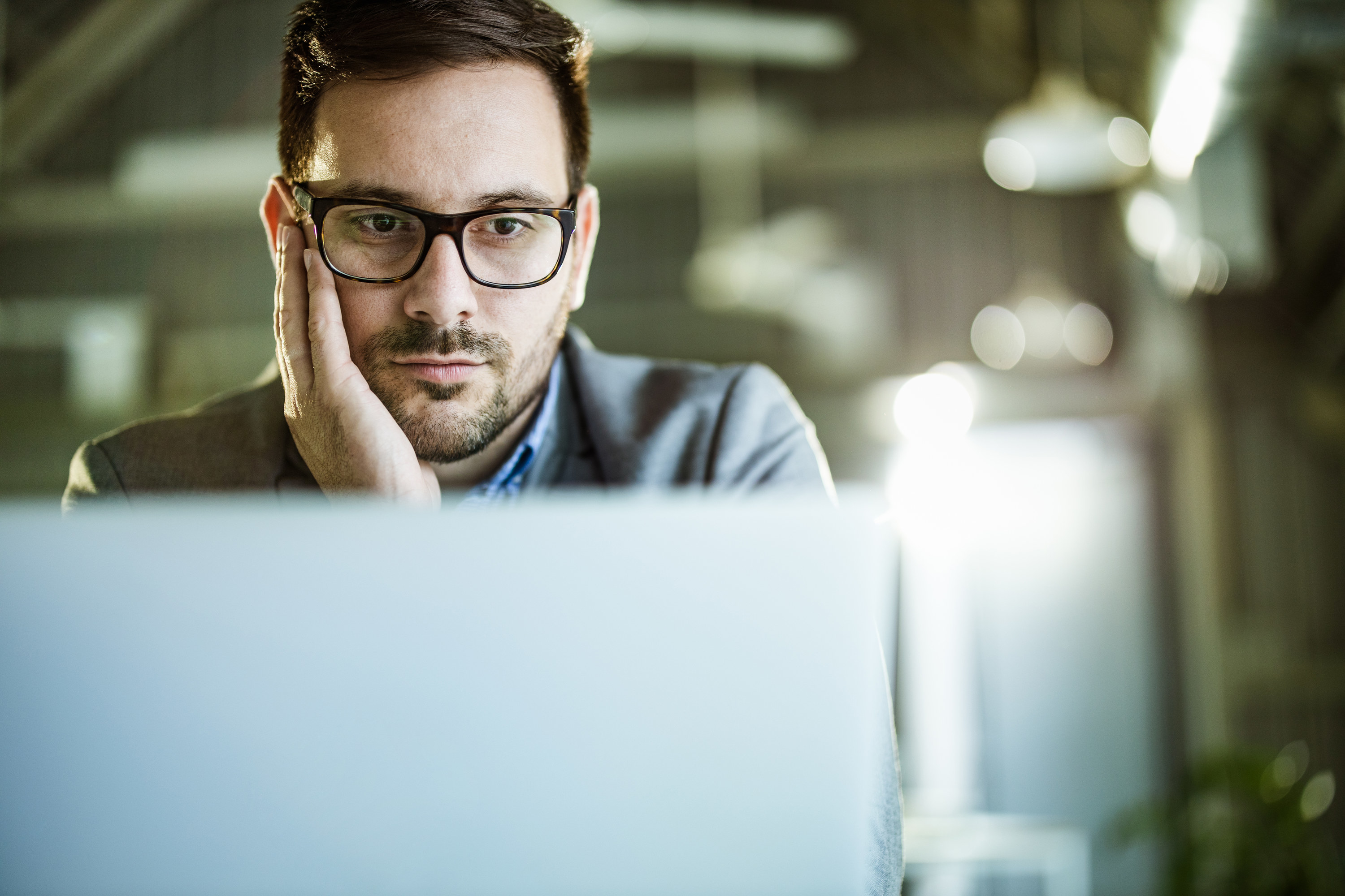 young man thinking in an office