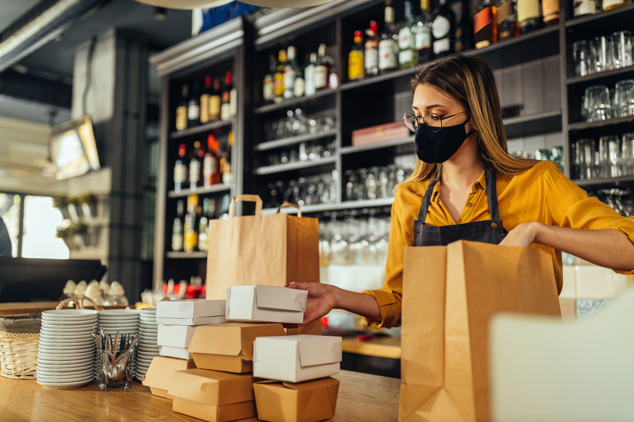 A worker packaging food