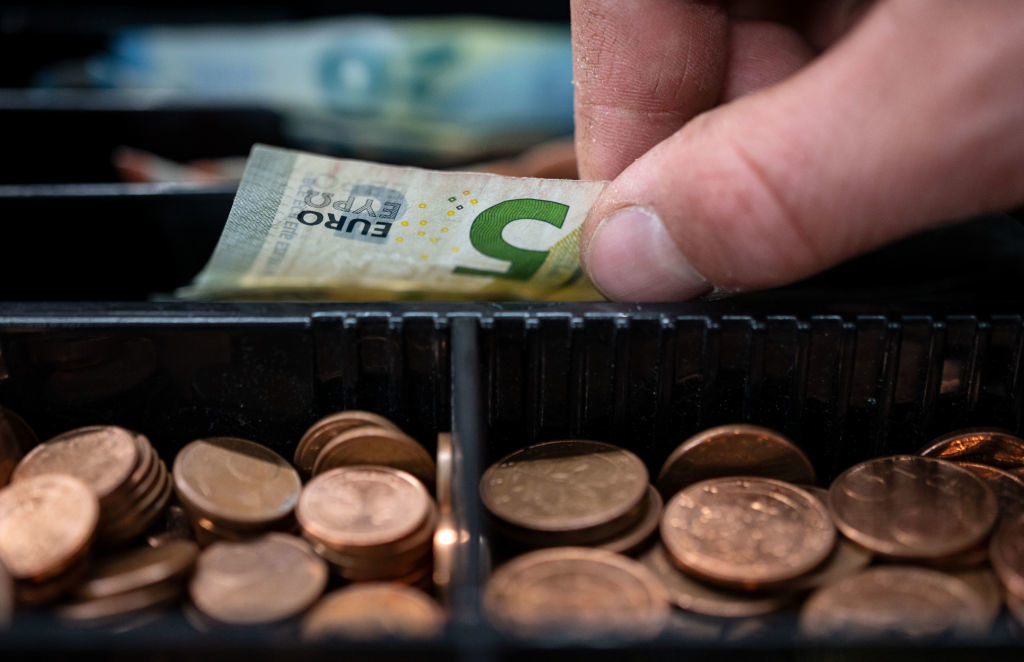 A cash register with money