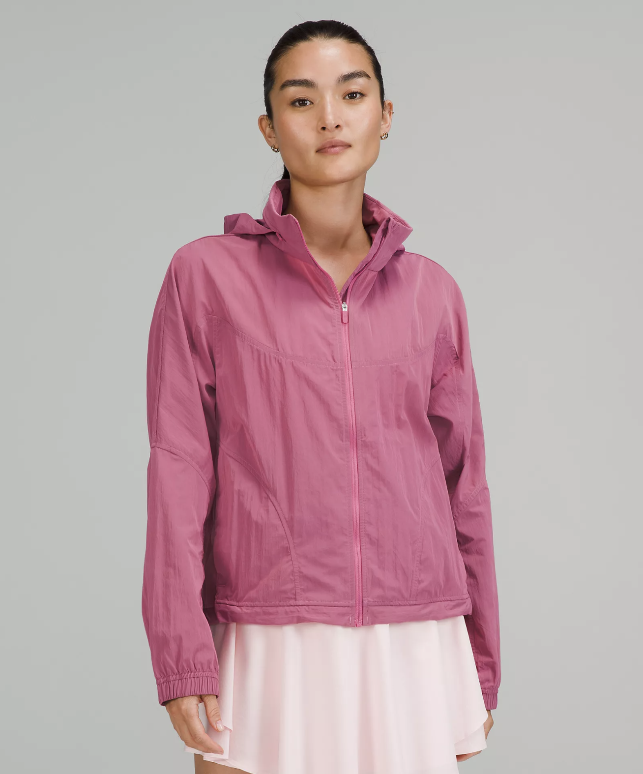 a person wearing the cute lightweight jacket with a tennis skirt