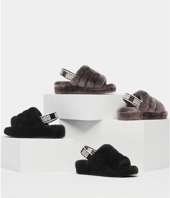 two pairs of fluffy slippers in black and gray