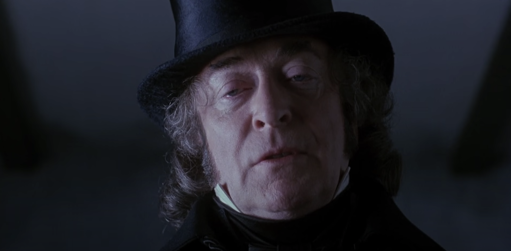 Michael Caine as Ebenezer Scrooge