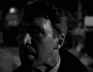 A frightened George Bailey looks around