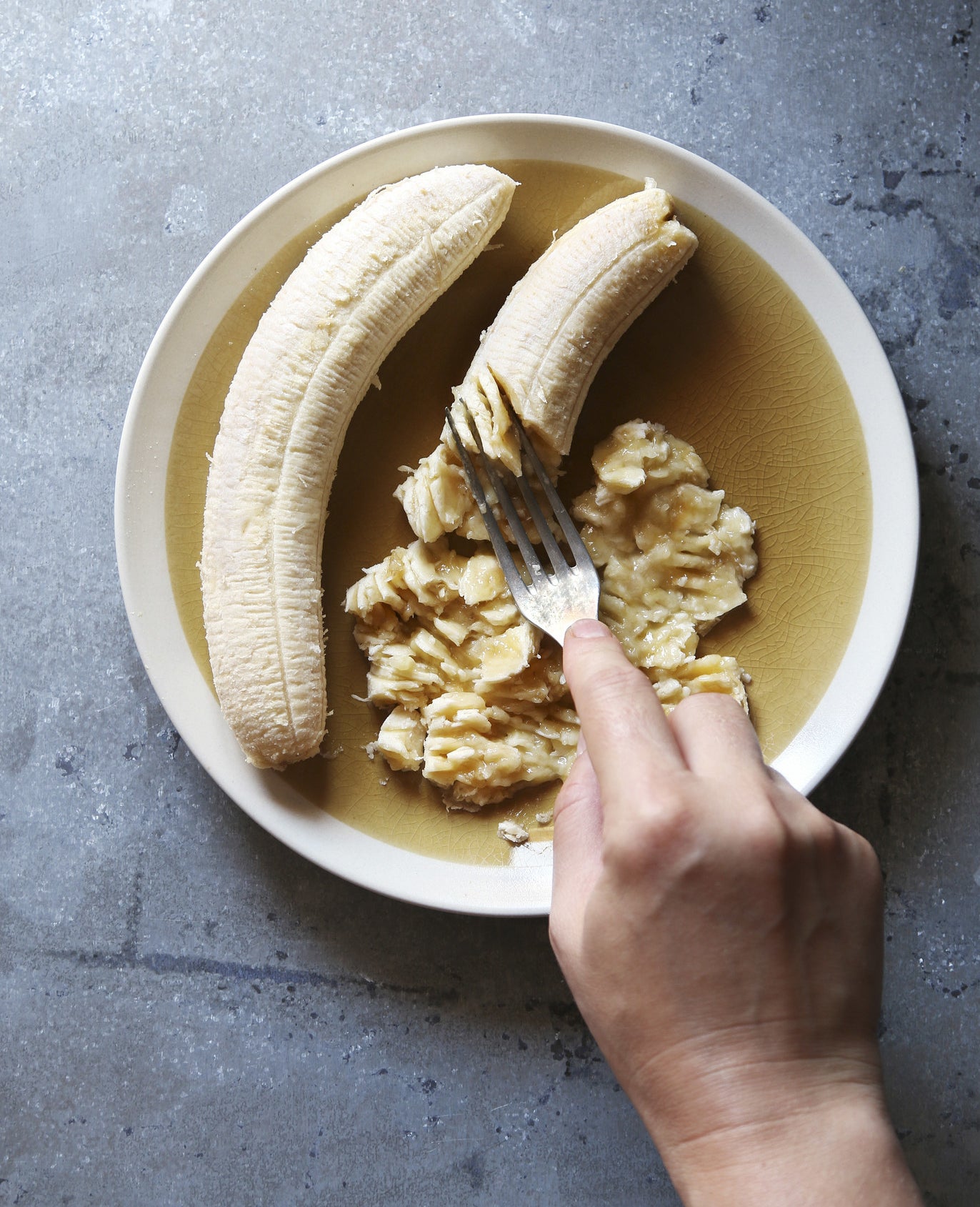 Mashing banana in a bowl