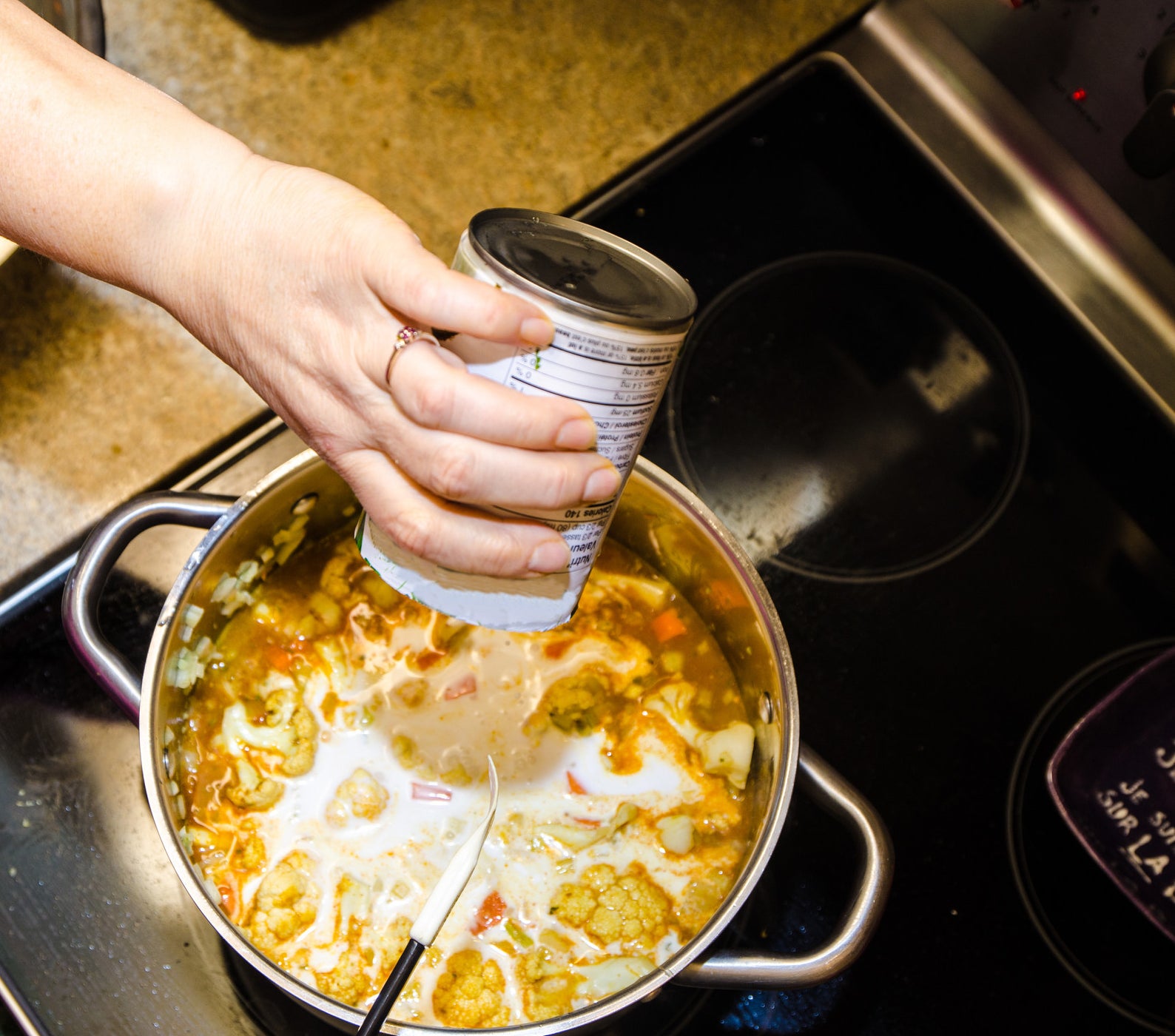 Making coconut milk curry