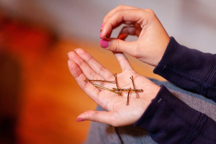 bobby pins in the palm of a hand