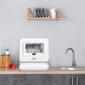 Countertop dishwasher placed on sink