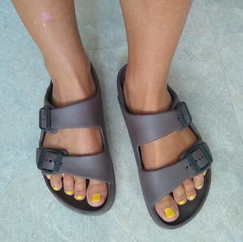 Reviewer wearing the brown sandals