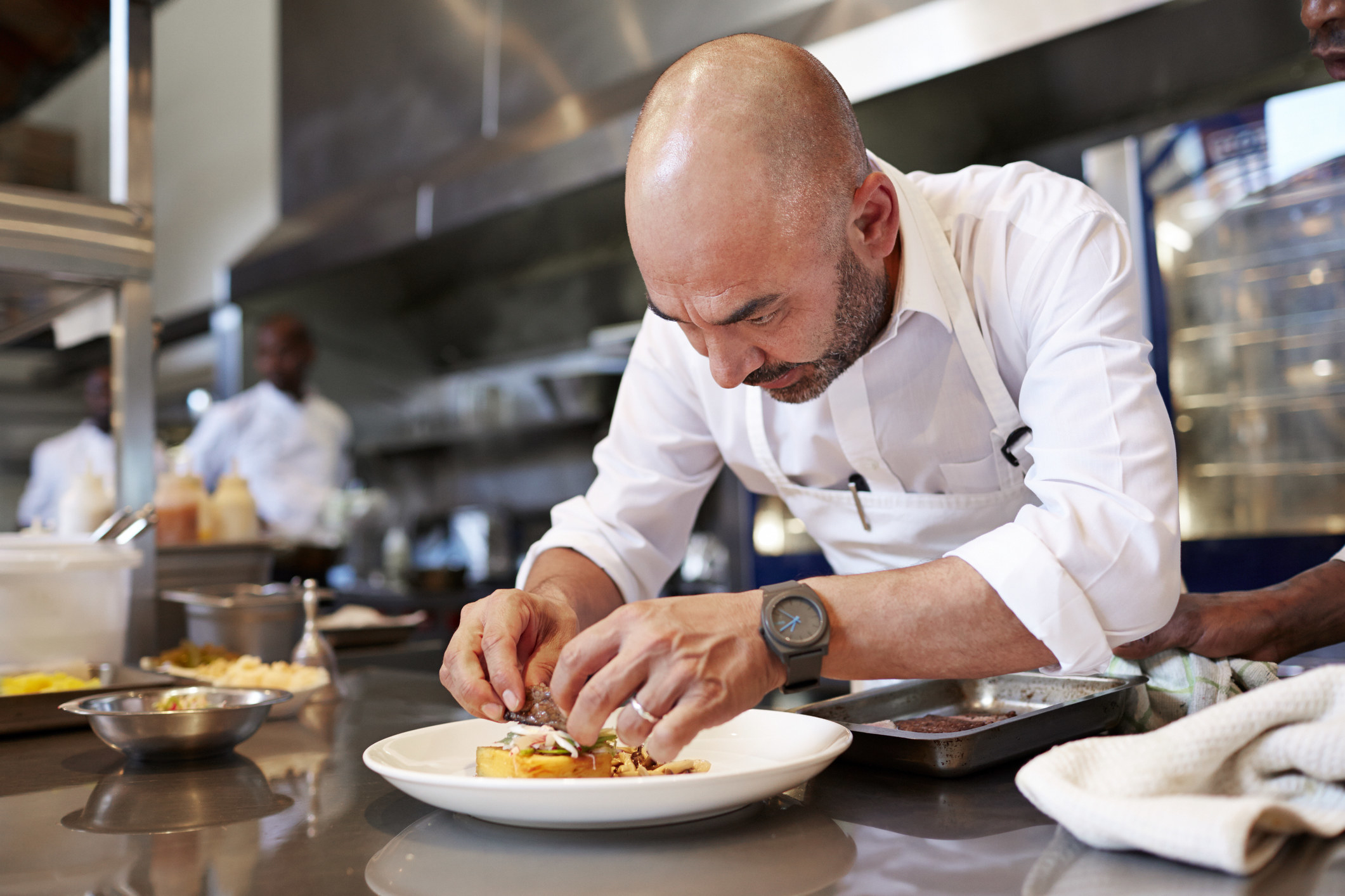 a chef plating a dish