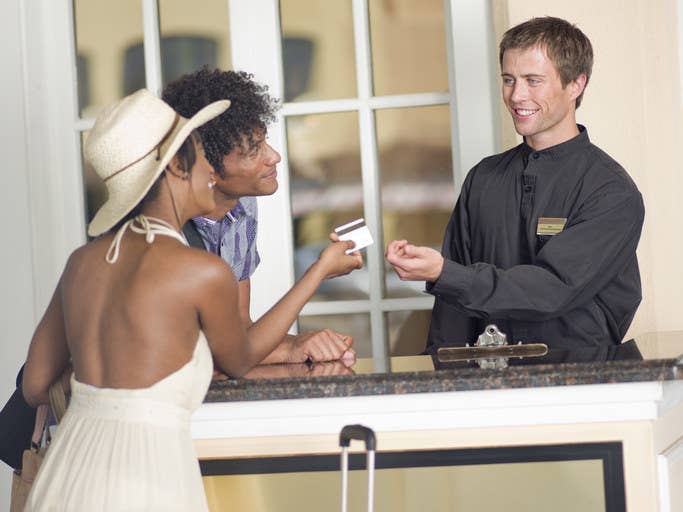 people checking into a hotel