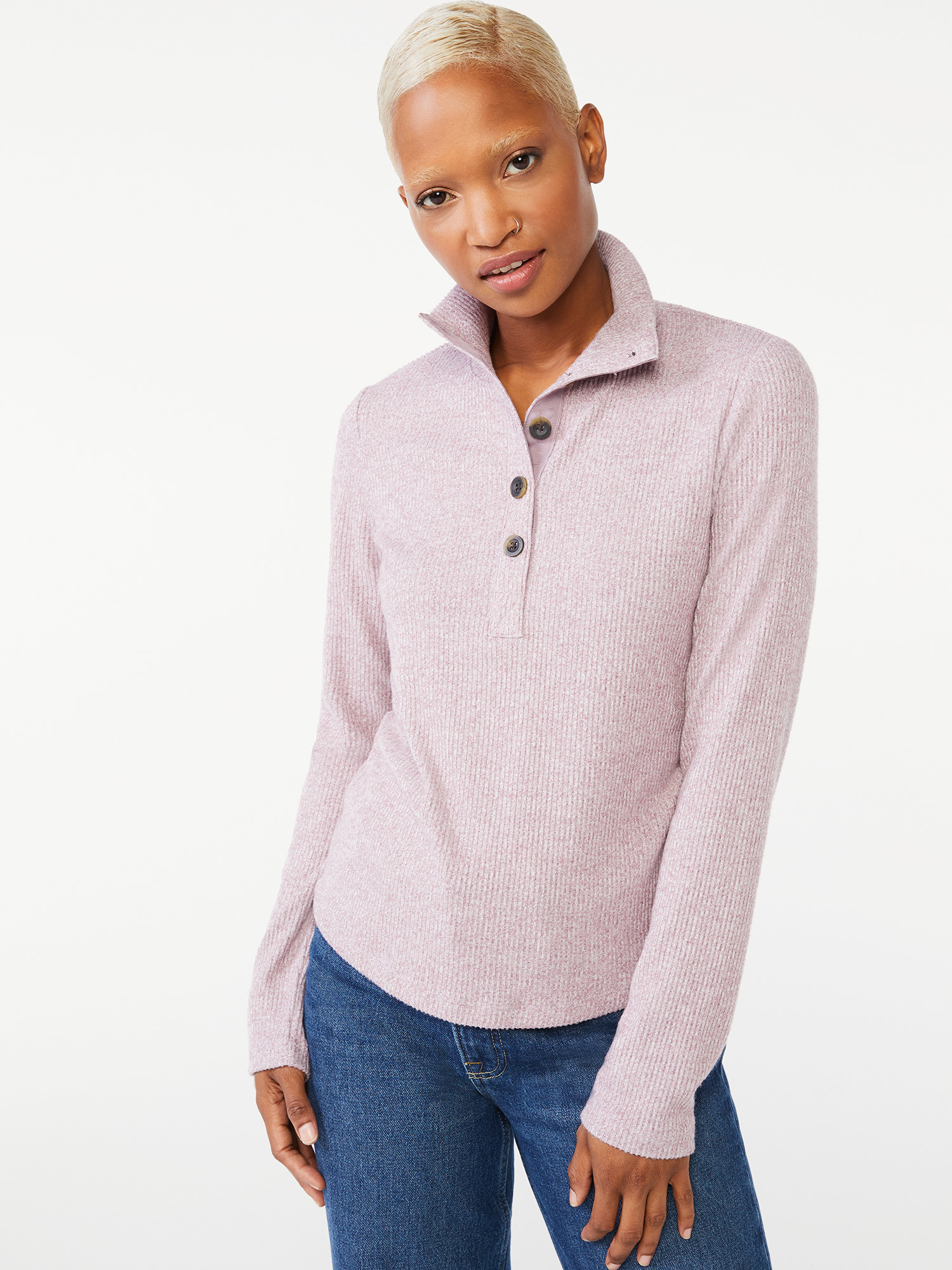 a model in a lilac pull-over henley and dark wash jeans