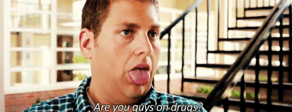 Jonah Hill as Schmitt and Channing Tatum as Jenko sticking their tongues out in &quot;21 Jump Street&quot; as someone asks &quot;are. you guys on drugs&quot;