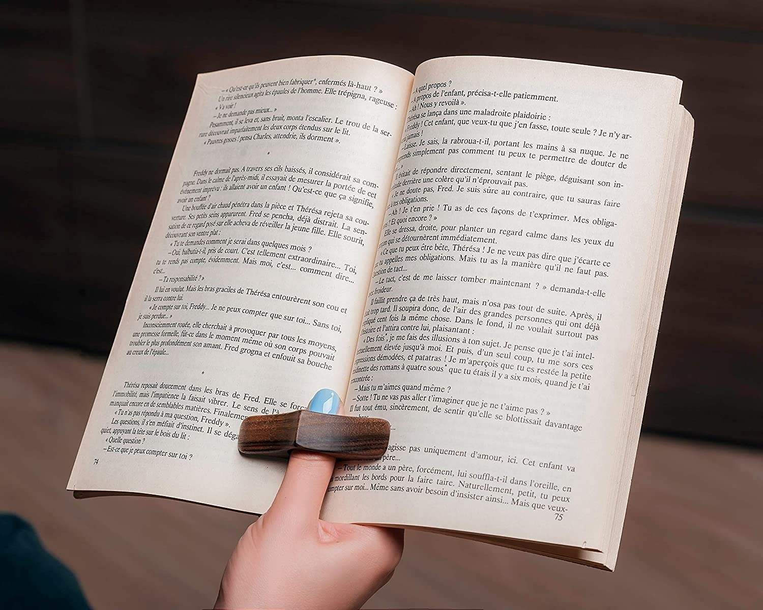 A person using the book page holder