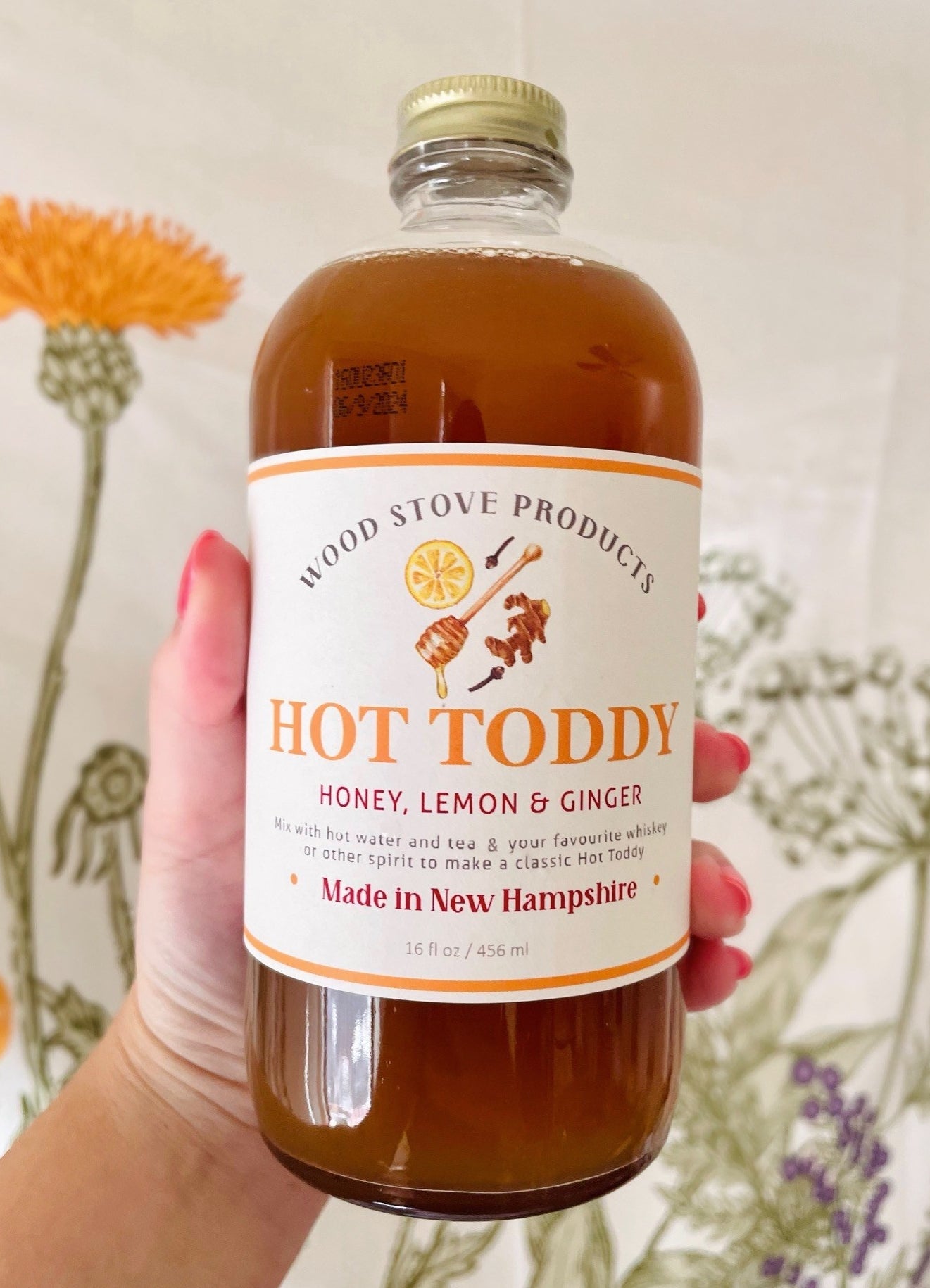 A bottle of the hot toddy with honey, lemon, and ginger