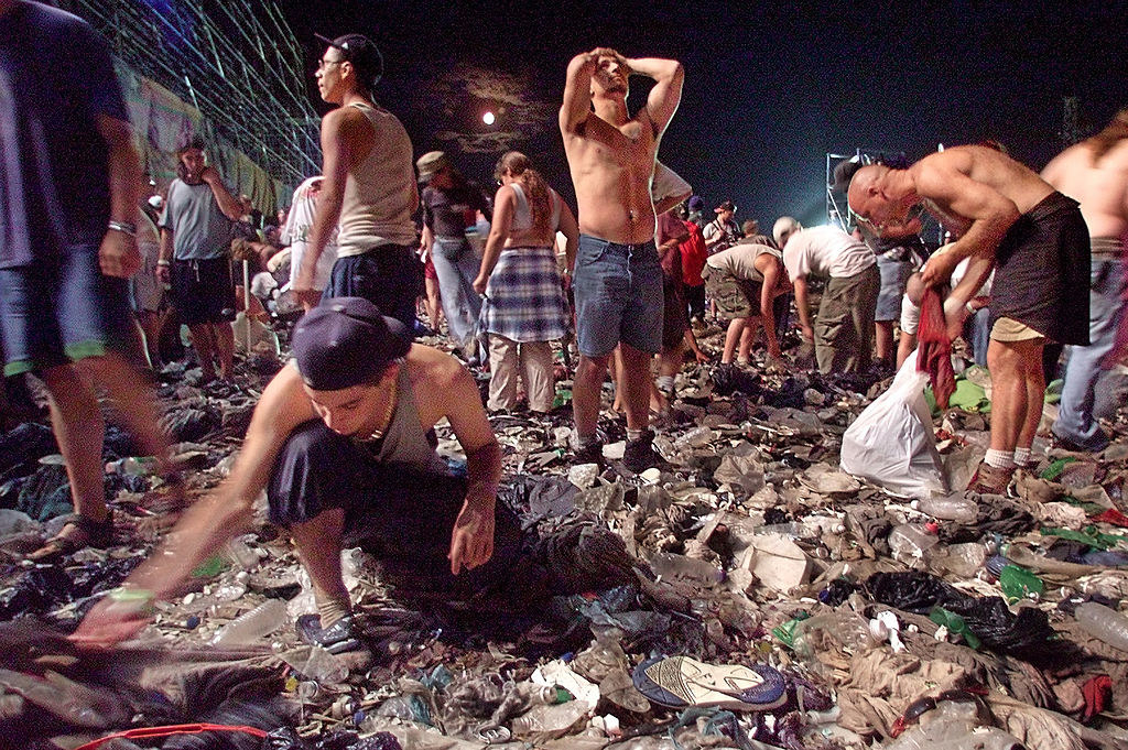 people amongst trash at Woodstock 99