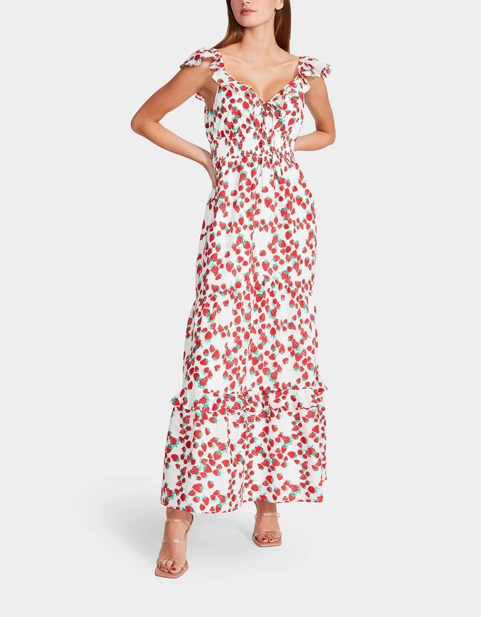 model wearing the white maxi dress with red cherry pattern