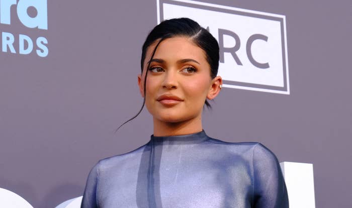 A closeup of Kylie rocking an updo on the red carpet of an event