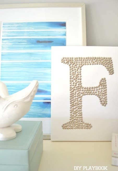 F monogram made with thumbtacks