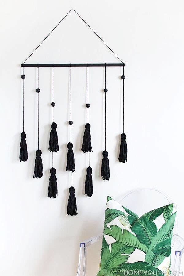 wall hanging with black tassels