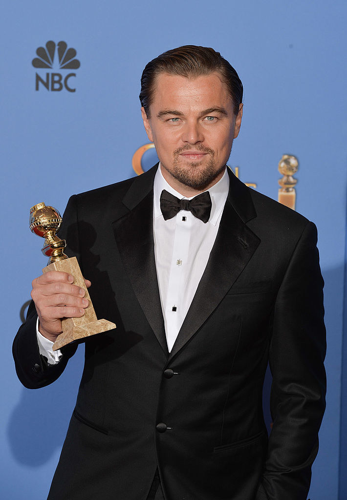 Leonardo DiCaprio holding a Golden Globe