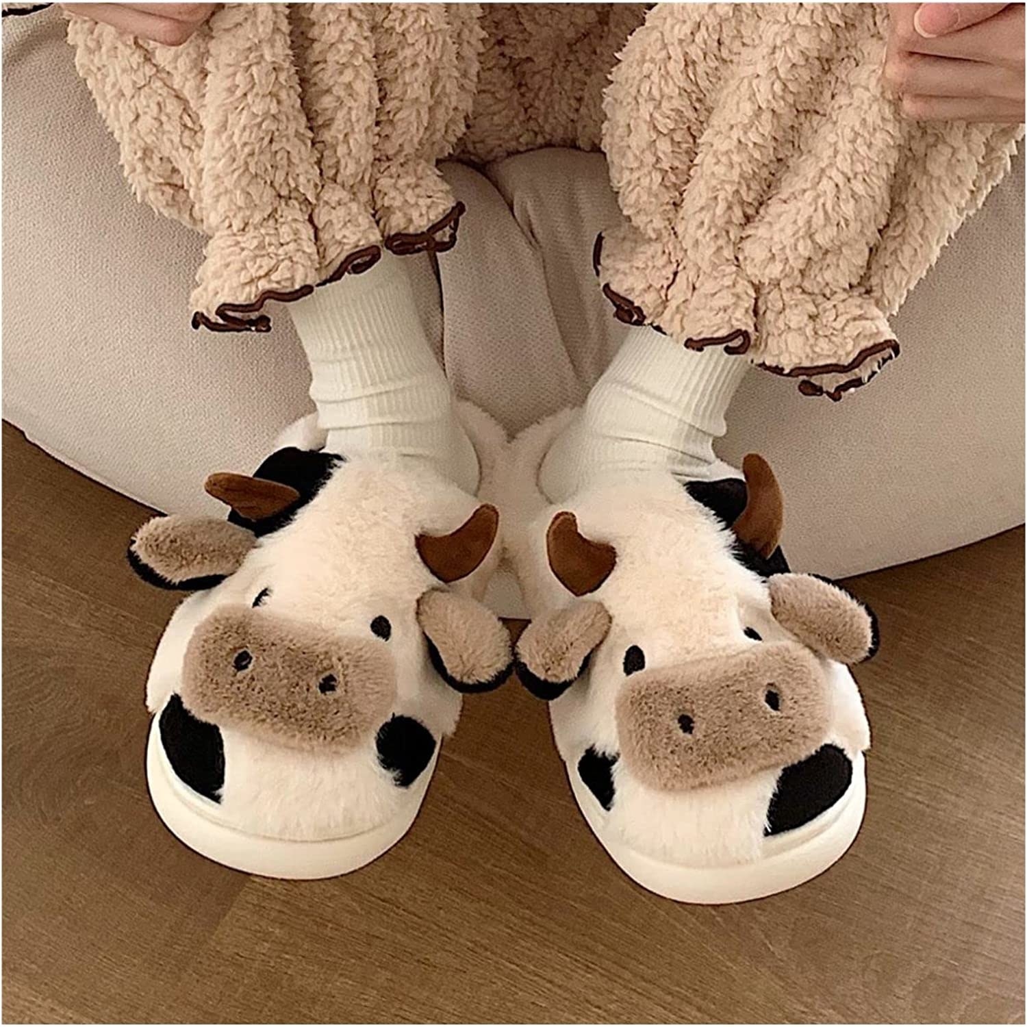 a person wearing cow slippers