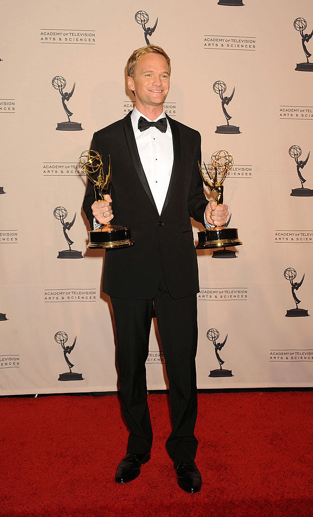 Neil Patrick Harris holding his Emmys
