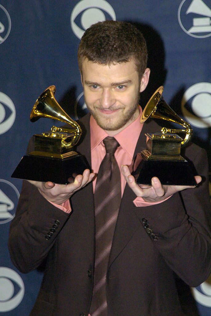 Justin Timberlake holding his Grammys