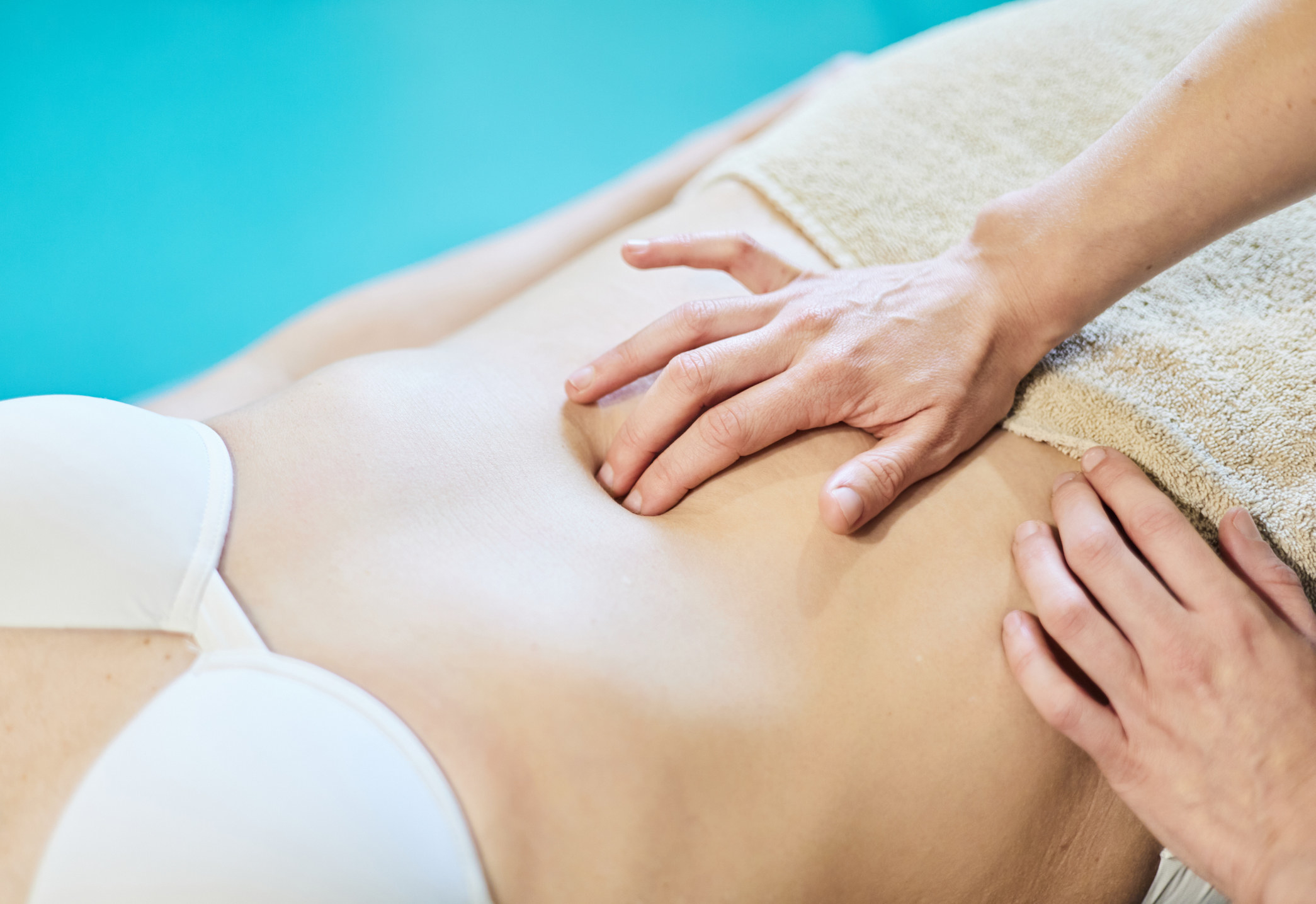Stock photo of an abdominal massage during physical therapy