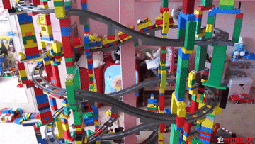 a huge lego train set collapsing