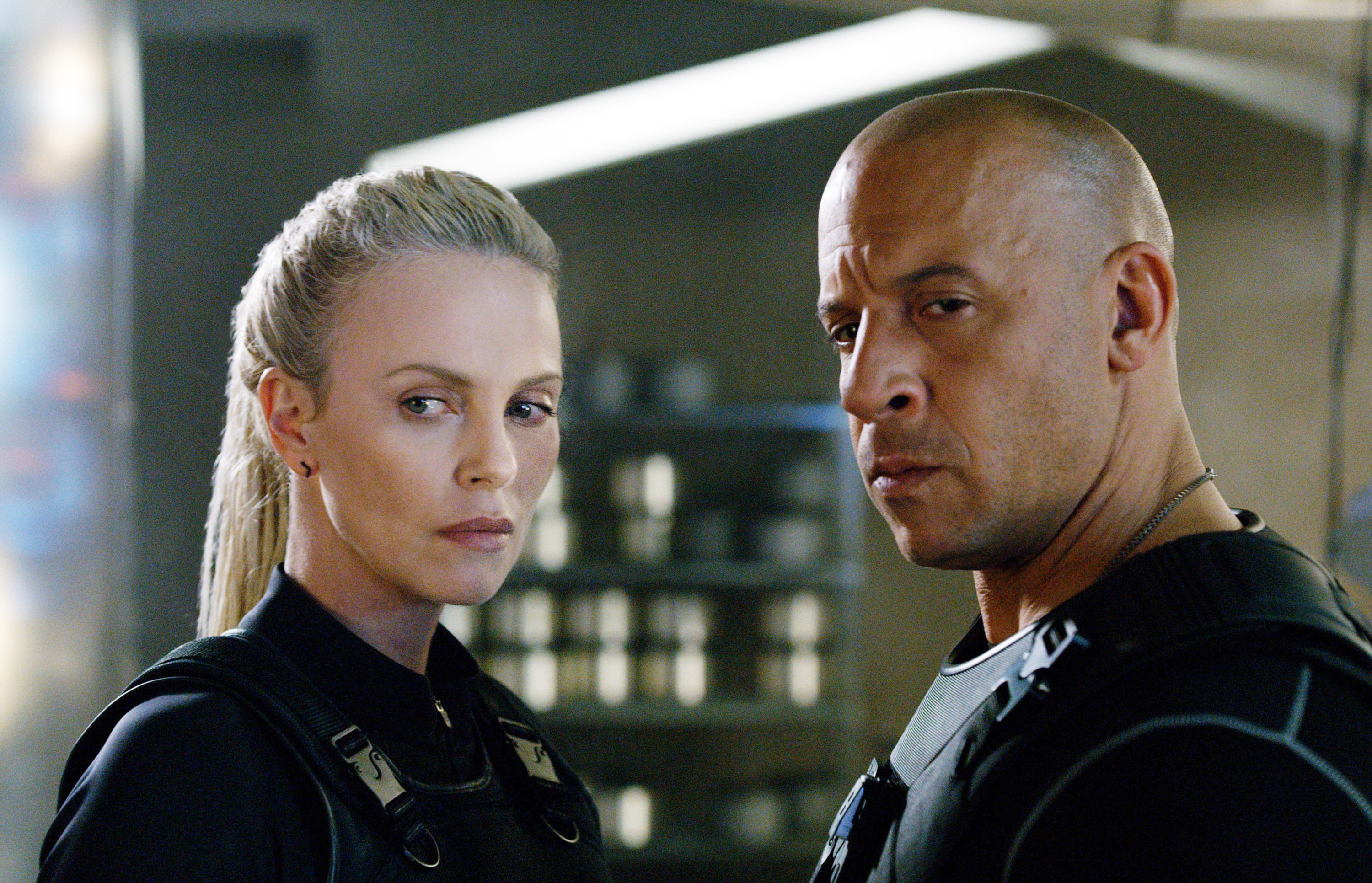 Charlize Theron and Vin Diesel look in the same direction