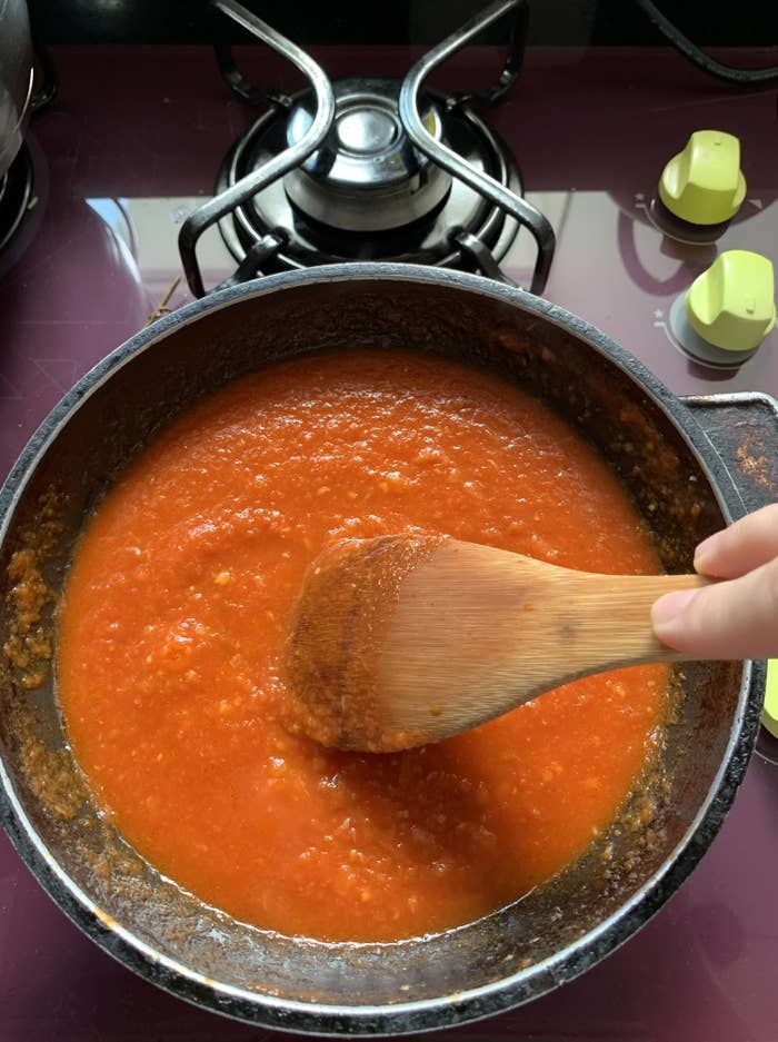 Tomato sauce on the stove.