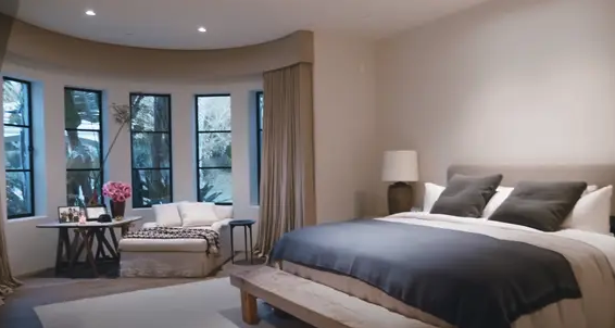 A bedroom with neutral colors