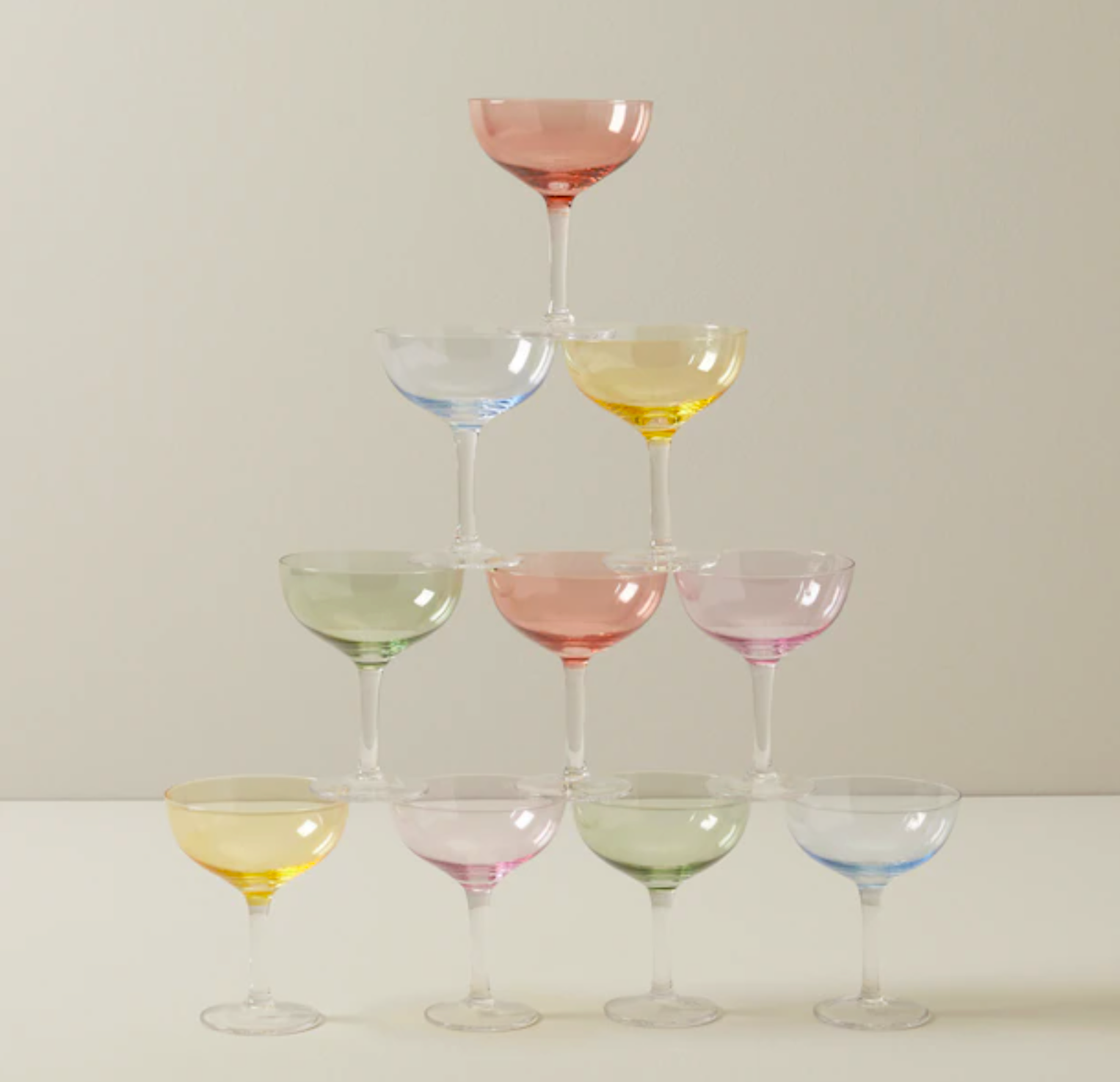 The coupe glasses stacked in a pyramid