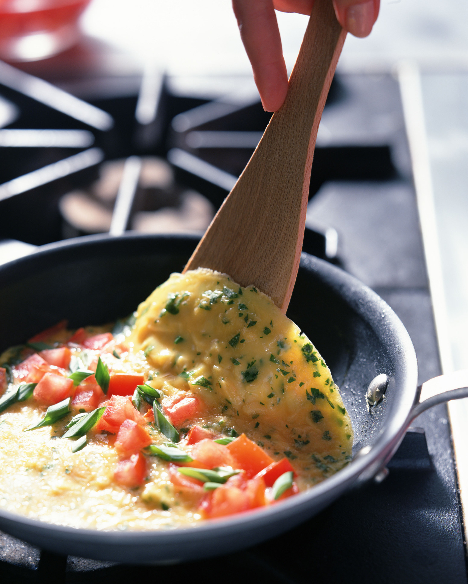 Person cooking an omelette.