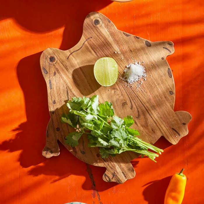 The platter with cilantro, a lime, and salt on it